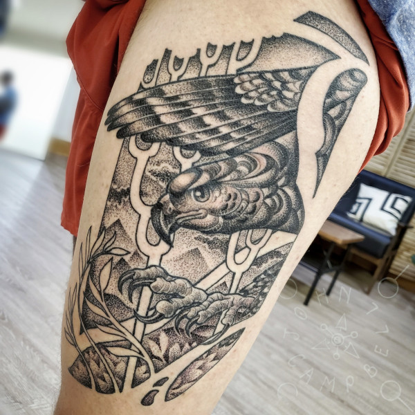 Black and grey dotwork thigh tattoo of bird of prey over mountains. Book a custom tattoo with John at Sacred Mandala Studio - Durham, NC.